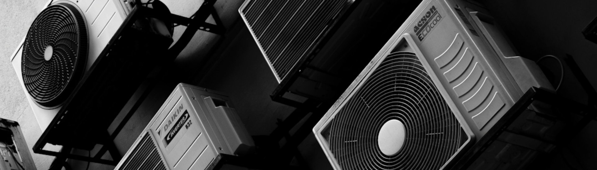 Multiple air conditioning units mounted on a wall
