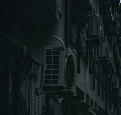 a building that has a bunch of air conditioners on it